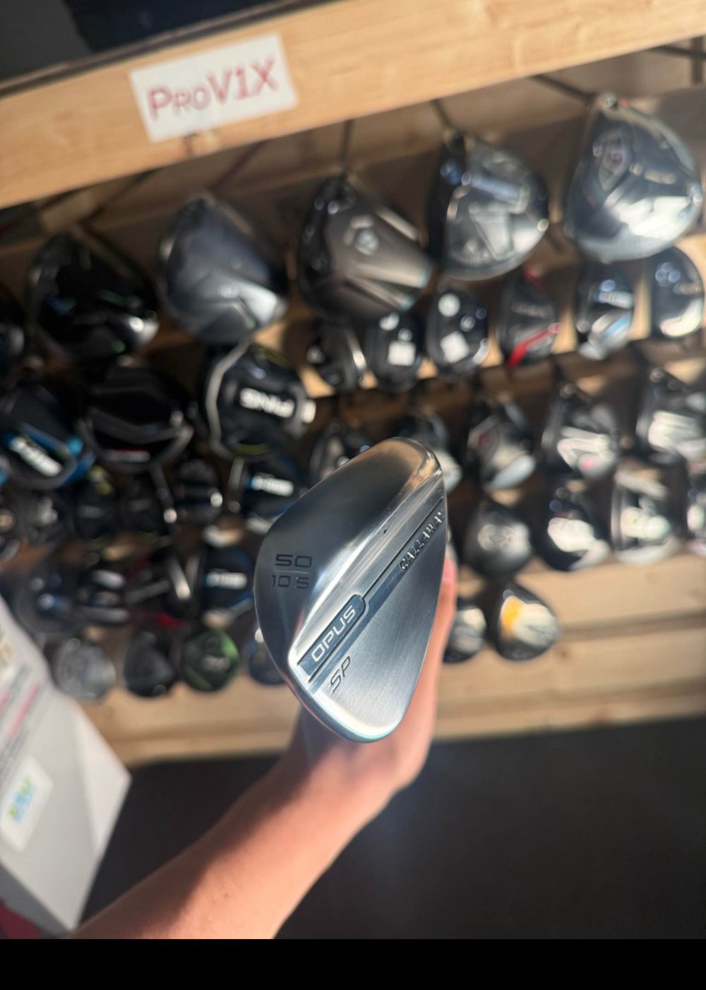 Callaway Opus SP 50 degree wedge on the club wall